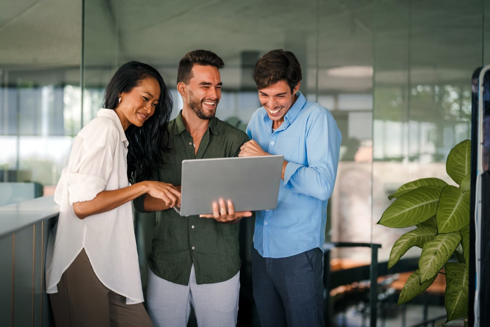 Product team reviewing automation work together in the office
