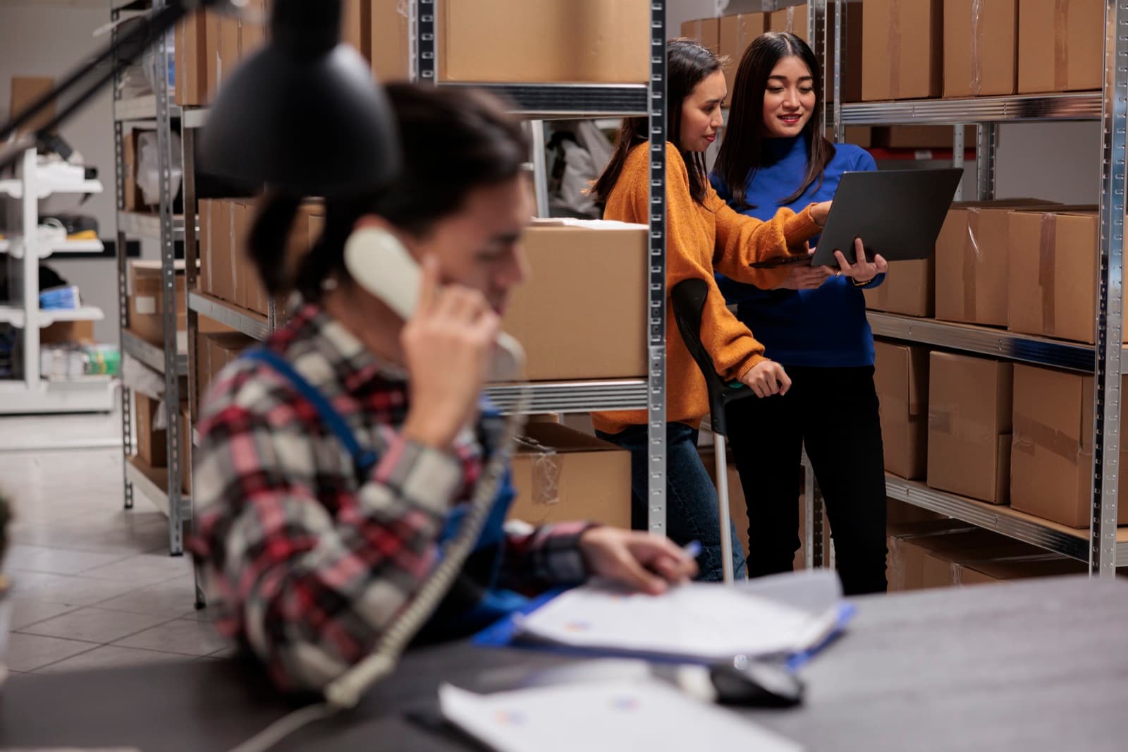 Warehouse team coordinating channel orders and inventory from the floor